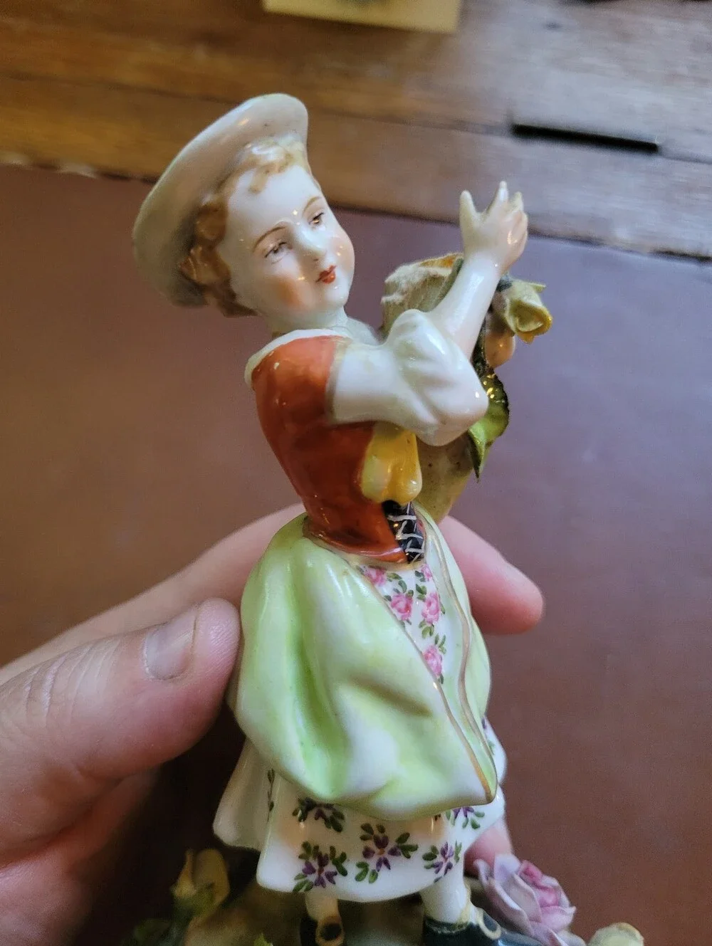 antique porcelain figurine, likely German from around 1900-repaired